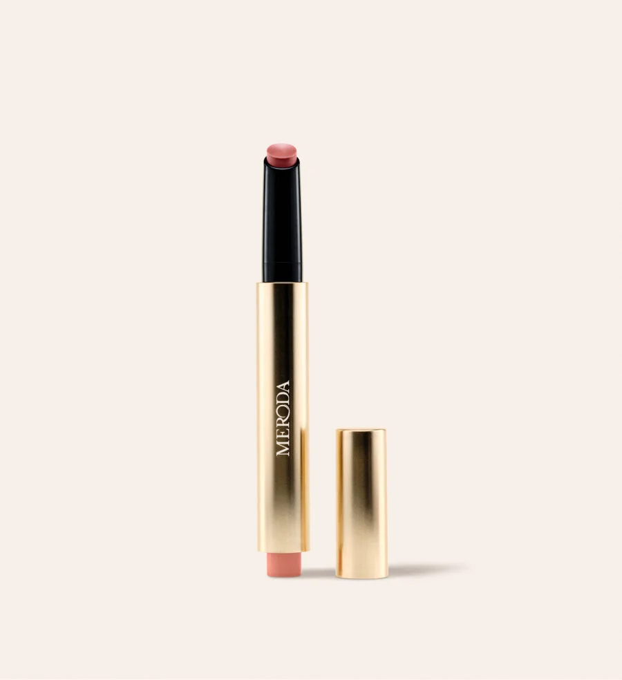 Hydrating Lip Tint in Dusty Rose, a sleek gold click pen with the cap removed on a cream background.