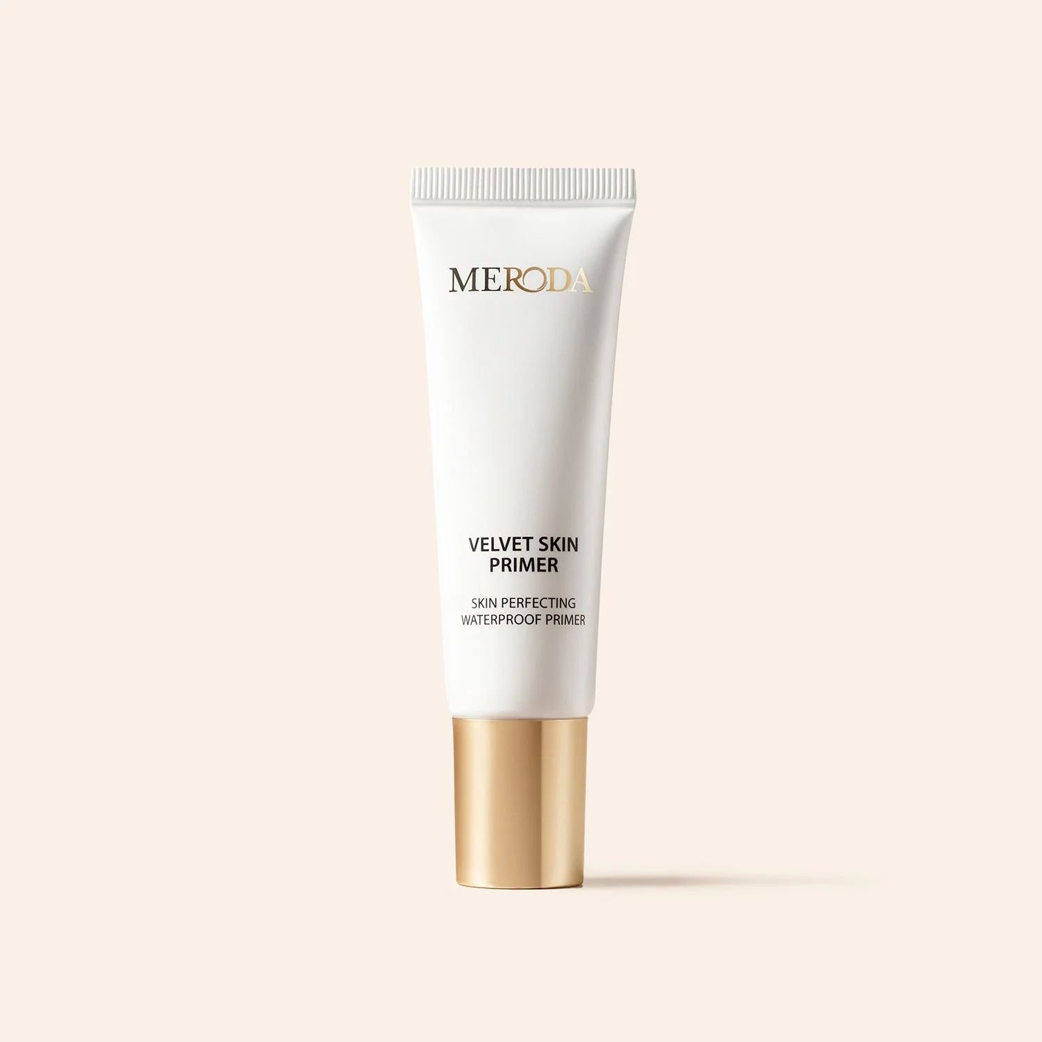 Meroda Cosmetics Velvet Skin Primer in a sleek white tube with a gold cap for a smooth, pore-blurring makeup base.