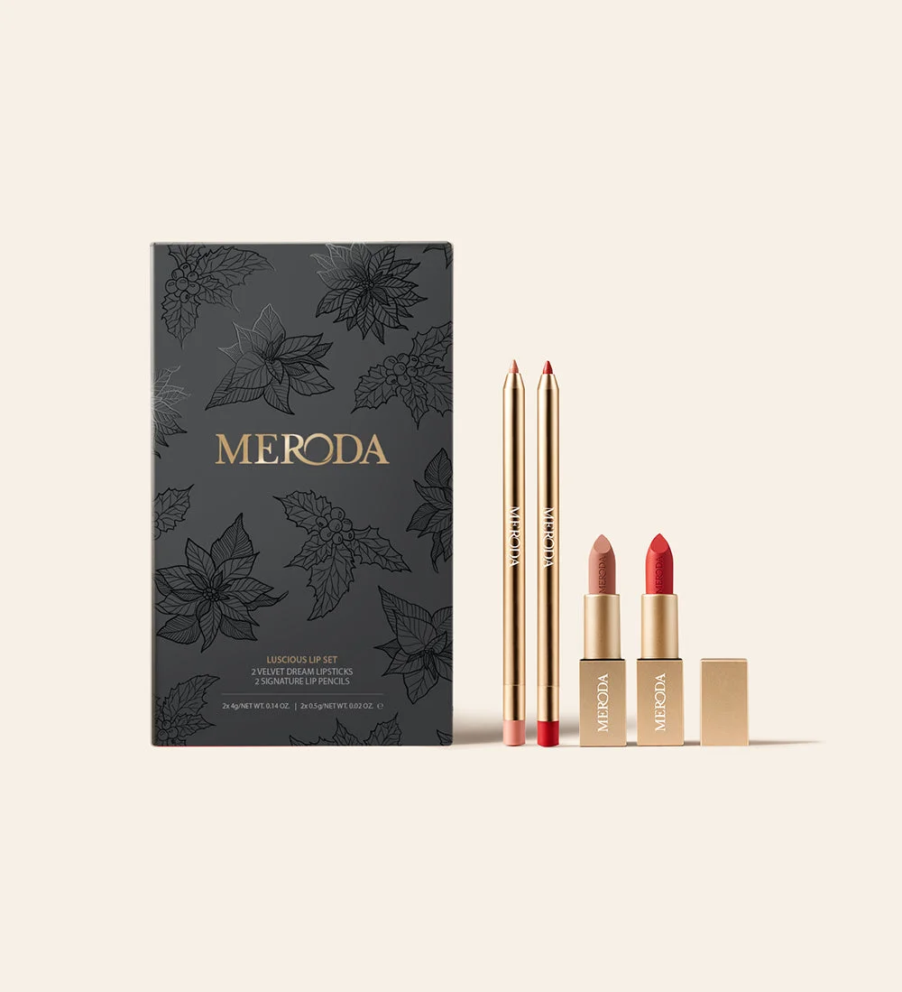 Luscious Lips Set with Velvet Dream Lipsticks and Signature Lip Pencils in Perfect Nude and Luscious Red beside holiday box.