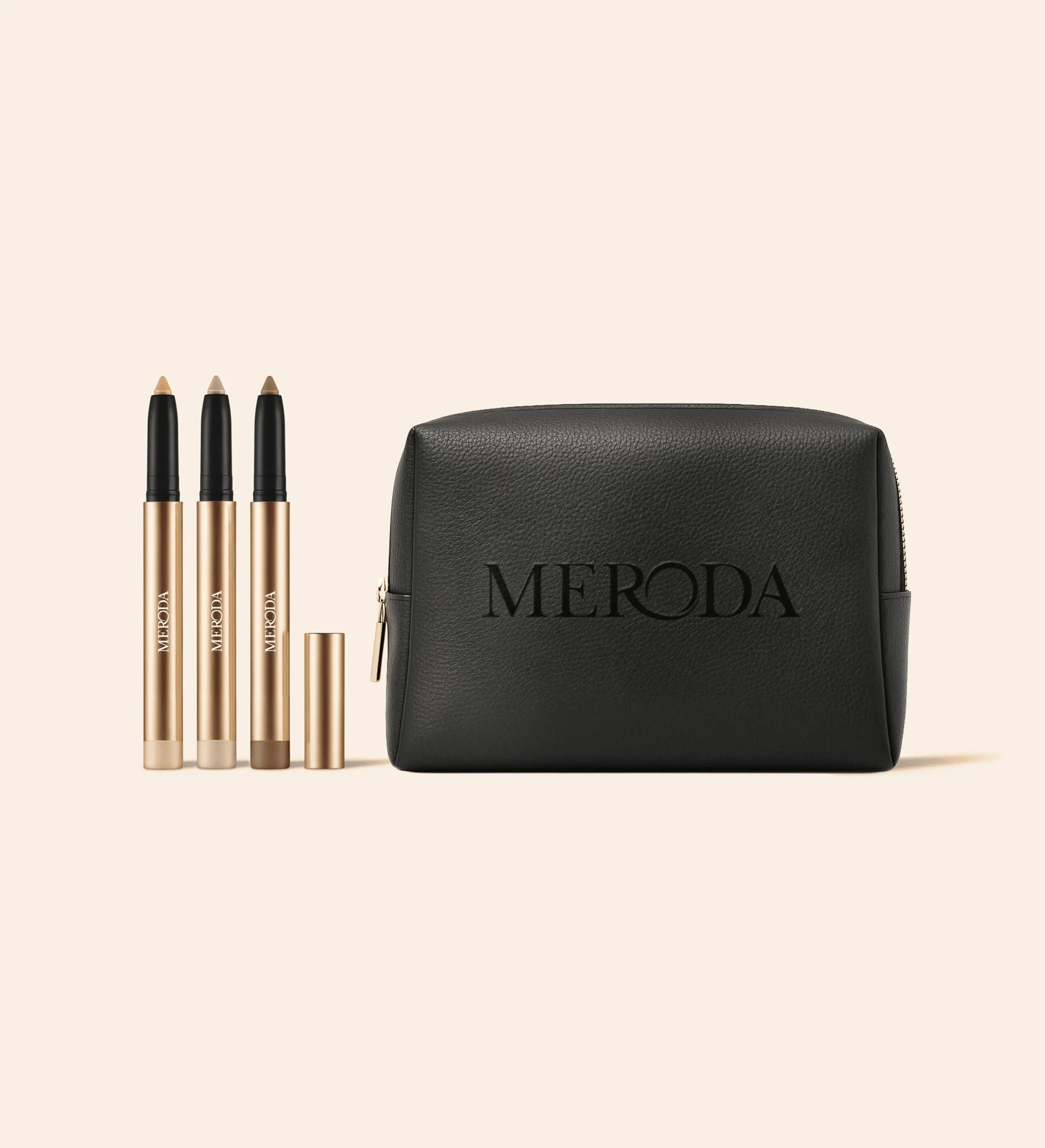 The Shimmer Discovery Set featuring three Eye Perfecting Shimmer Sticks and a black textured Meroda travel bag