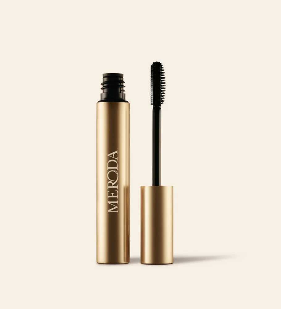Meroda Cosmetics The Precision Brow Gel in an open gold tube with a silicone applicator brush on a light background
