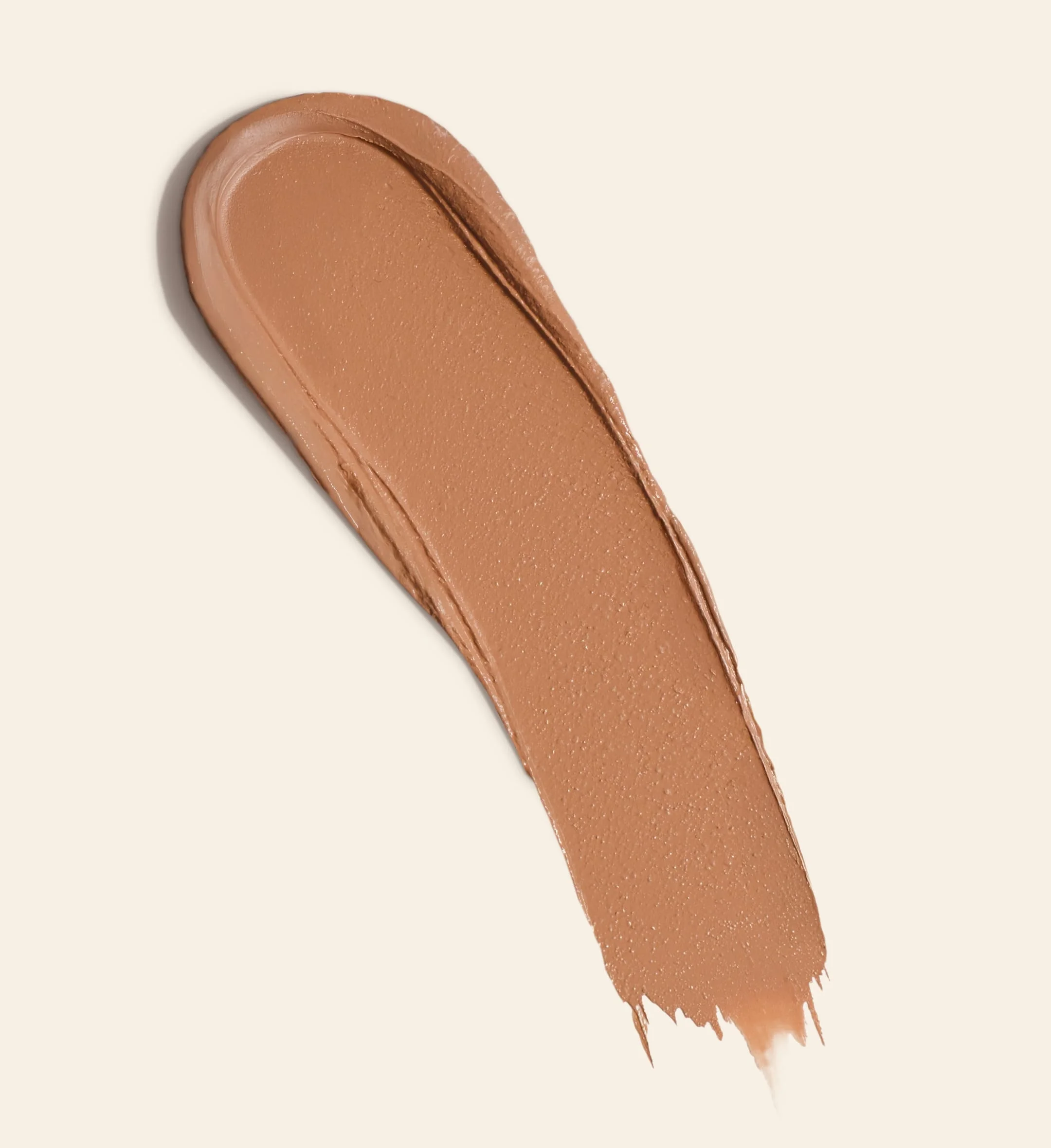 Meroda Cosmetics Soft Tan Bronzer creamy swatch in shade Light showcasing the buildable formula for a natural glow.