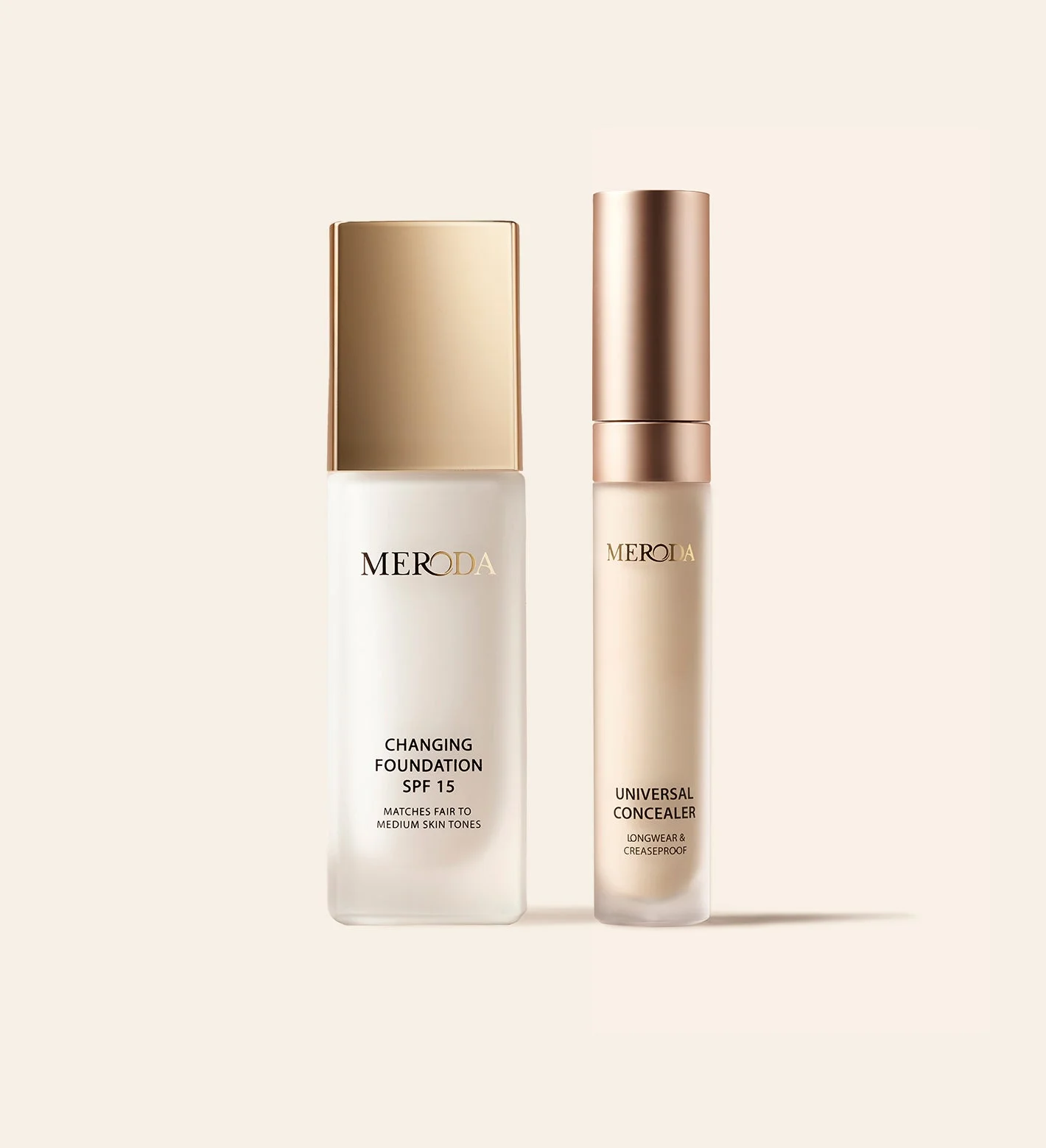 The Complexion Duo featuring Changing Foundation SPF 15 and Universal Concealer with gold caps on a light background