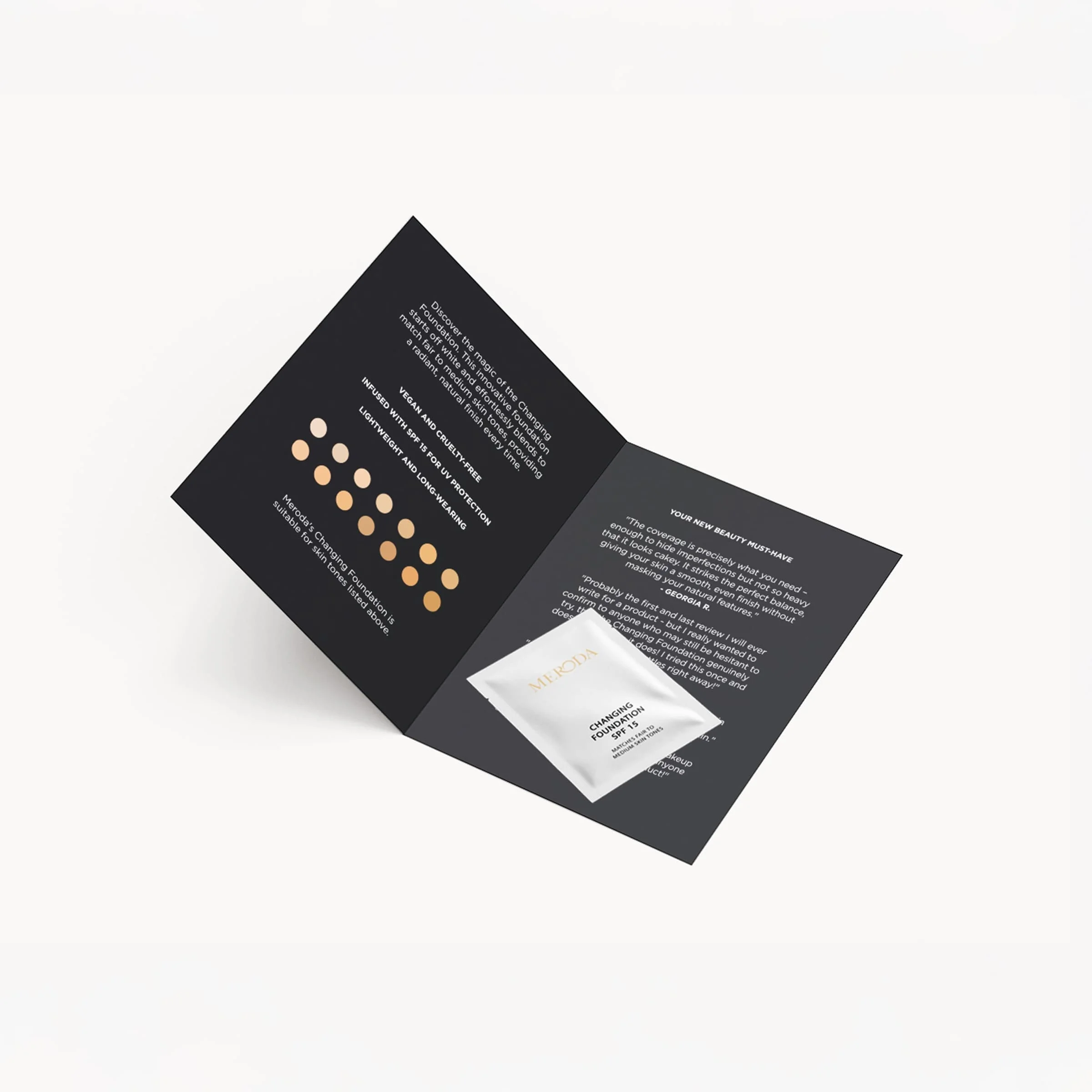 Meroda Cosmetics Changing Foundation Sample 1.5 ml sachet on a black leaflet with shade swatches and reviews