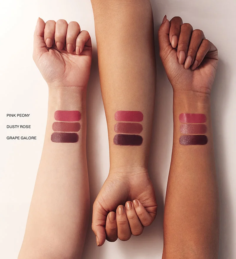 Vibrant Cheeks Liquid Blush swatches in Pink Peony, Dusty Rose, and Grape Galore on light, medium, and dark skin tones