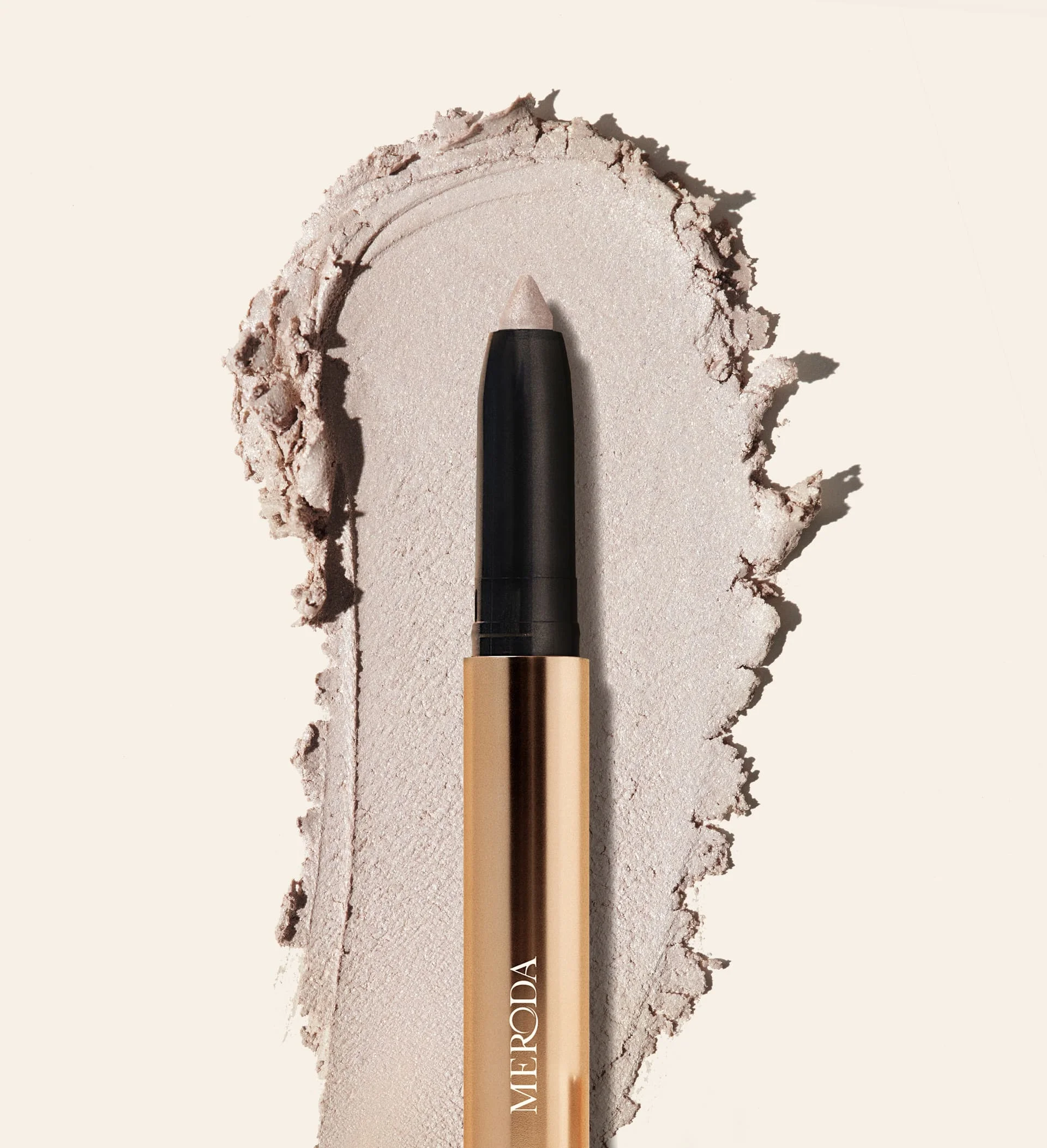 Meroda Eye Perfecting Shimmer Stick in Pearl with a creamy, radiant texture swatch to brighten your eye color.