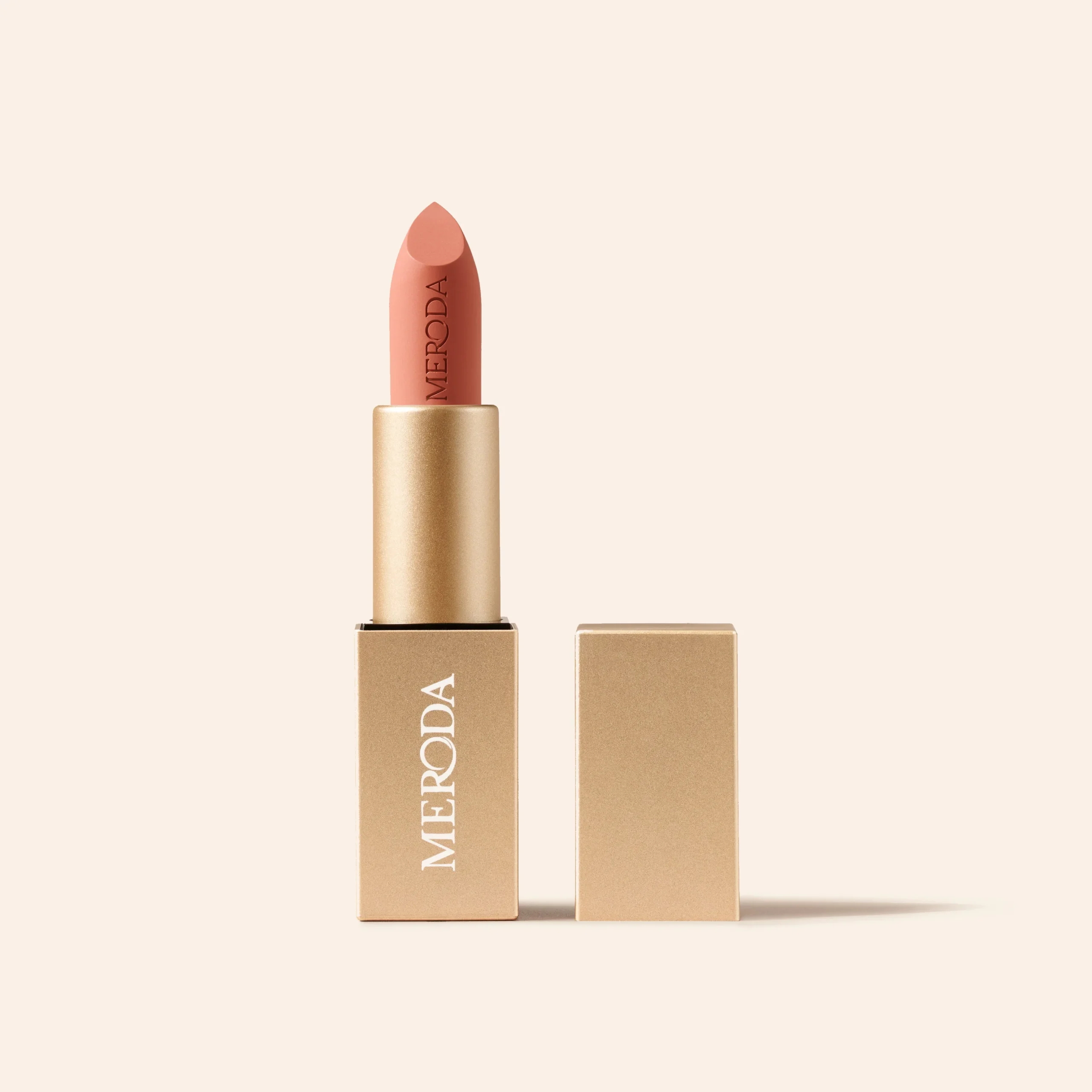 Velvet Dream Lipstick in Perfect Nude with a matte gold case and a long-lasting velvet finish.