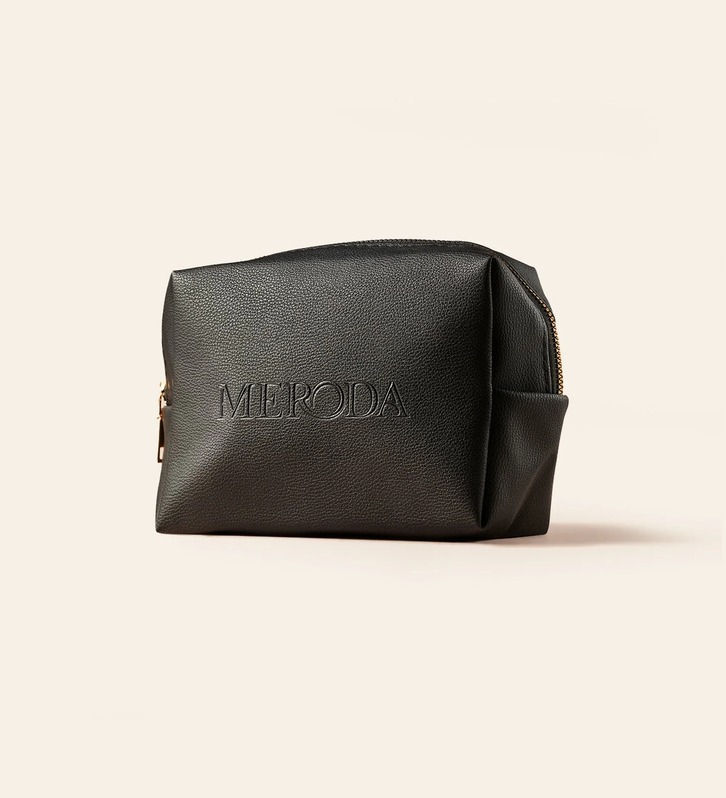Black pebbled Travel Bag with a structured design and embossed Meroda logo to keep beauty essentials organized
