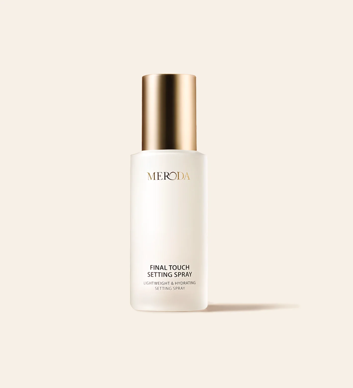 Meroda Cosmetics Final Touch Setting Spray in a frosted bottle with a gold cap for a lightweight, hydrating finish.