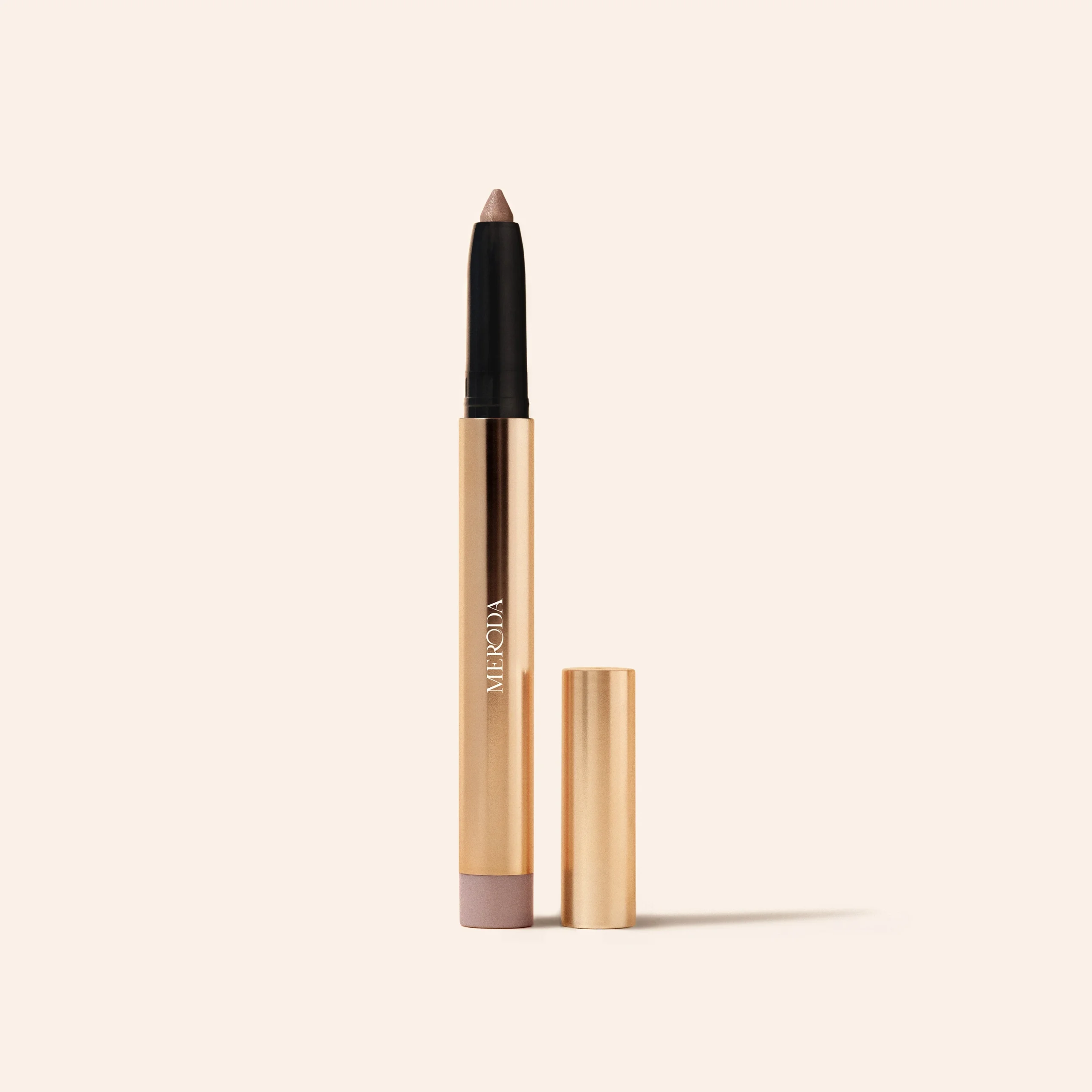 Meroda Cosmetics Eye Perfecting Shimmer Stick in Pearl, an open cream eyeshadow stick on a light background.