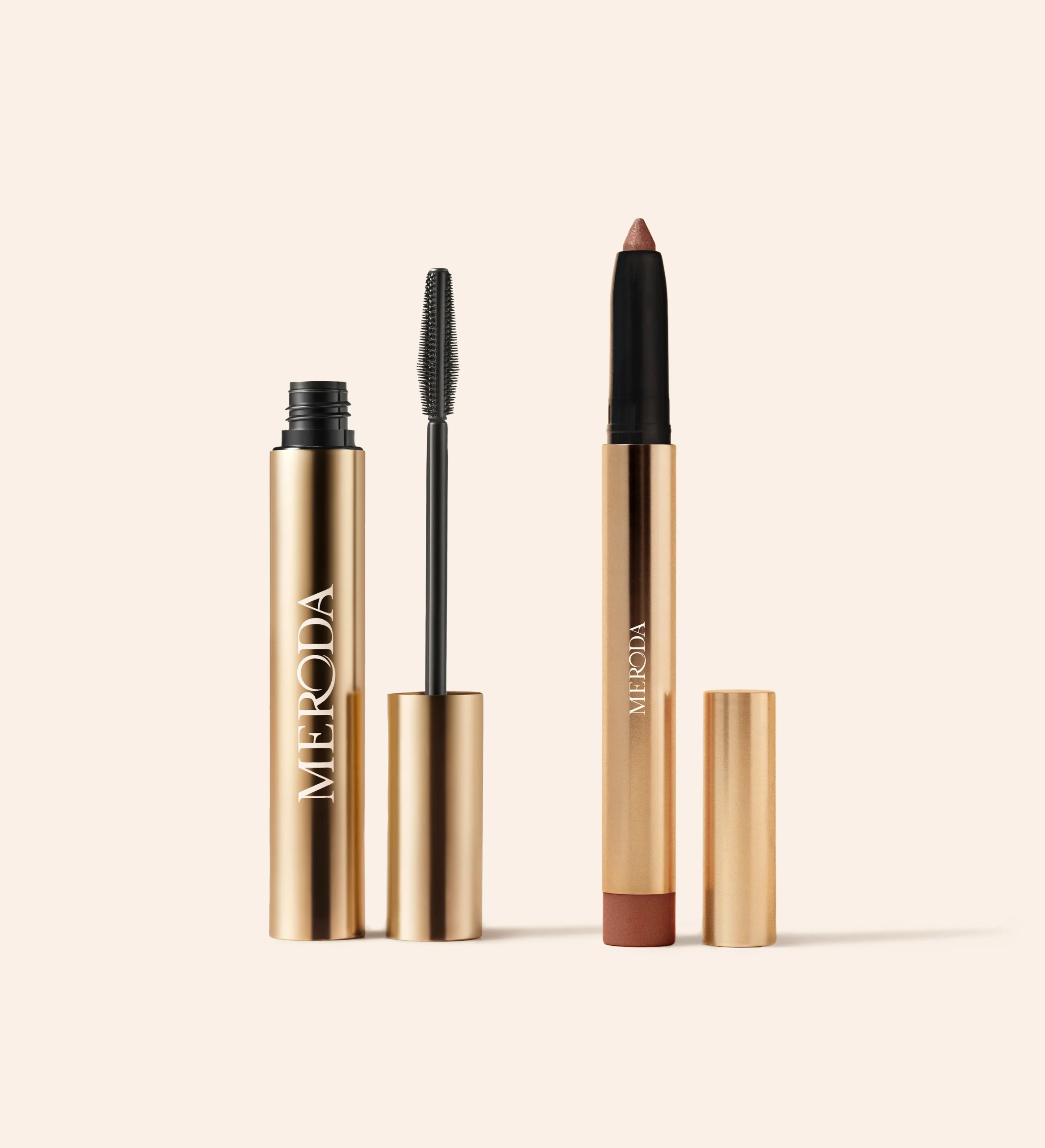 Effortless Gaze Duo featuring Gilded Lashes Mascara and Mauve Eye Perfecting Shimmer Stick in elegant gold packaging.