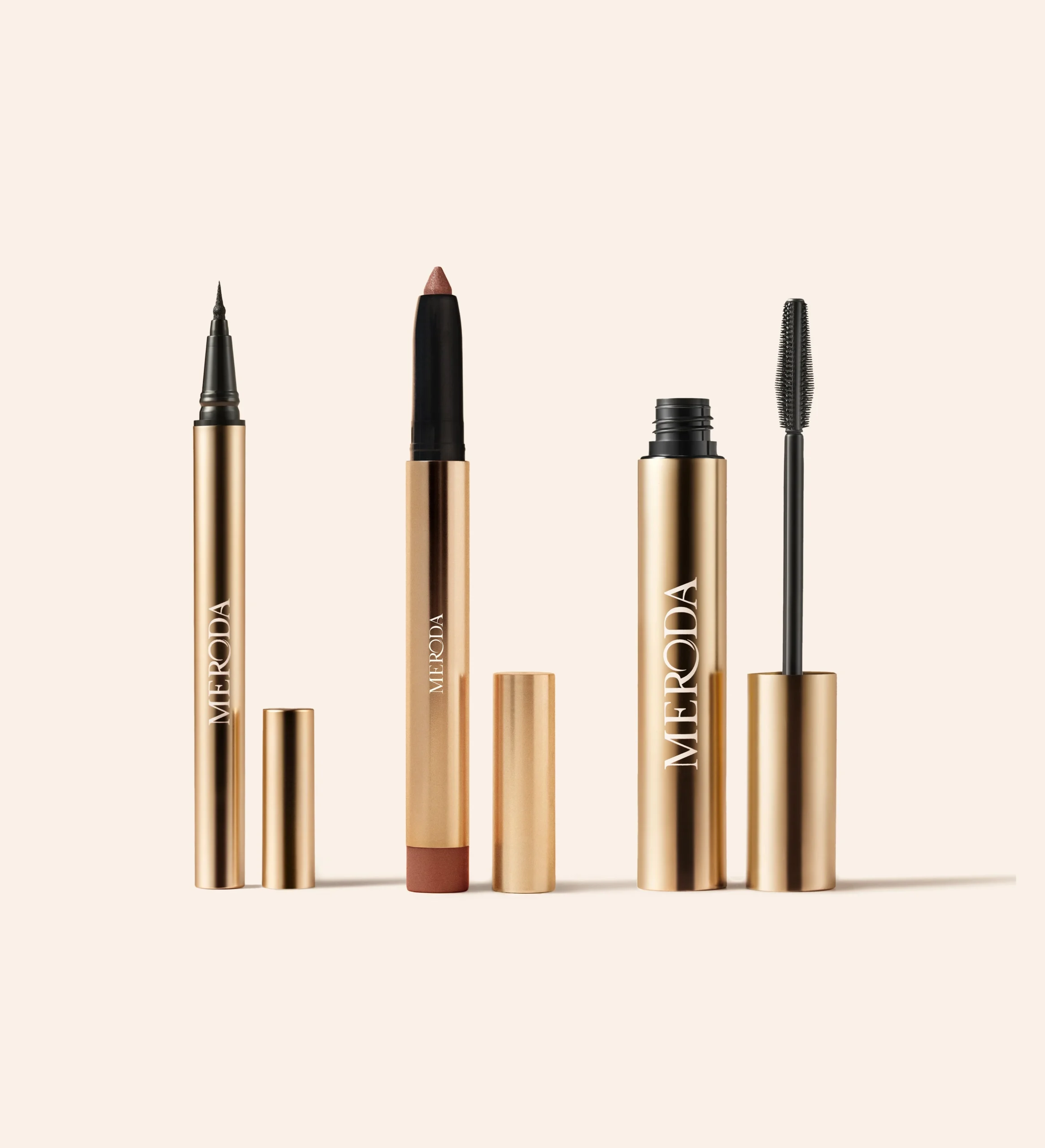 Meroda The Eye Edit: gold Gilded Lashes Mascara, waterproof eyeliner, and Eye Perfecting Shimmer Stick in Mauve.