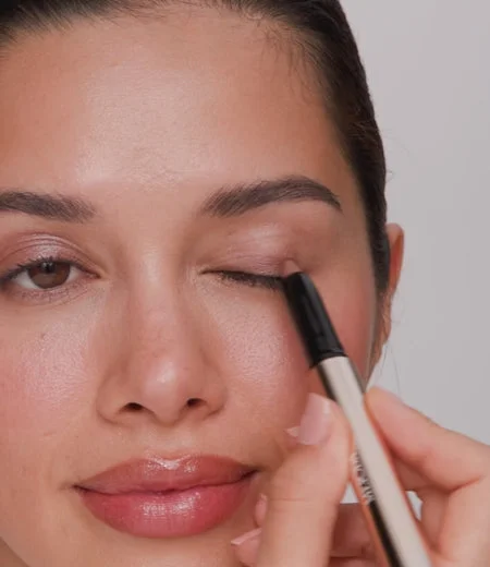 Eye Perfecting Shimmer Stick applied and blended on eyelids for a radiant, luminous finish and refreshed glow.